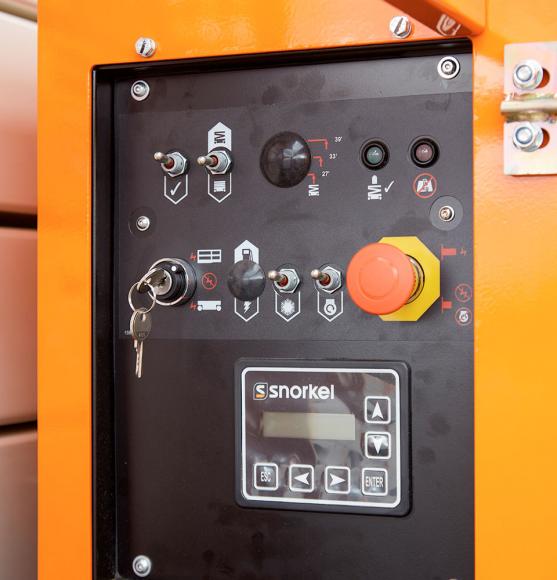 Black control panel with buttons and switches recessed in orange side module
